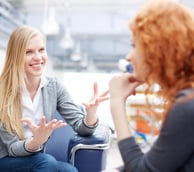2 women talking to each other