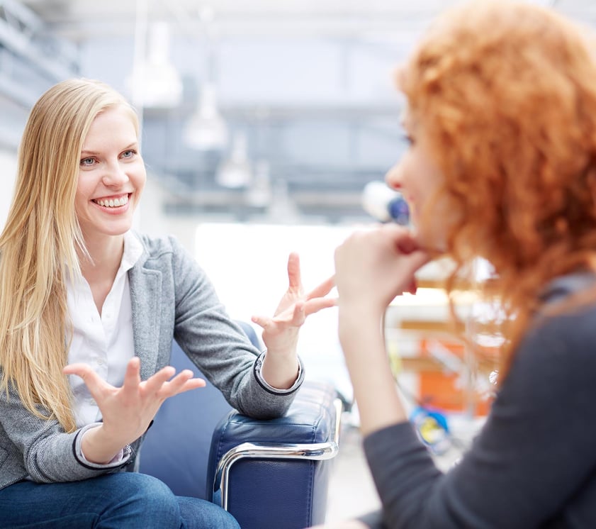2 women talking to each other