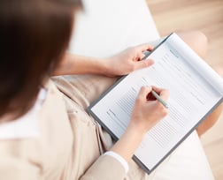 Lady filling out paperwork